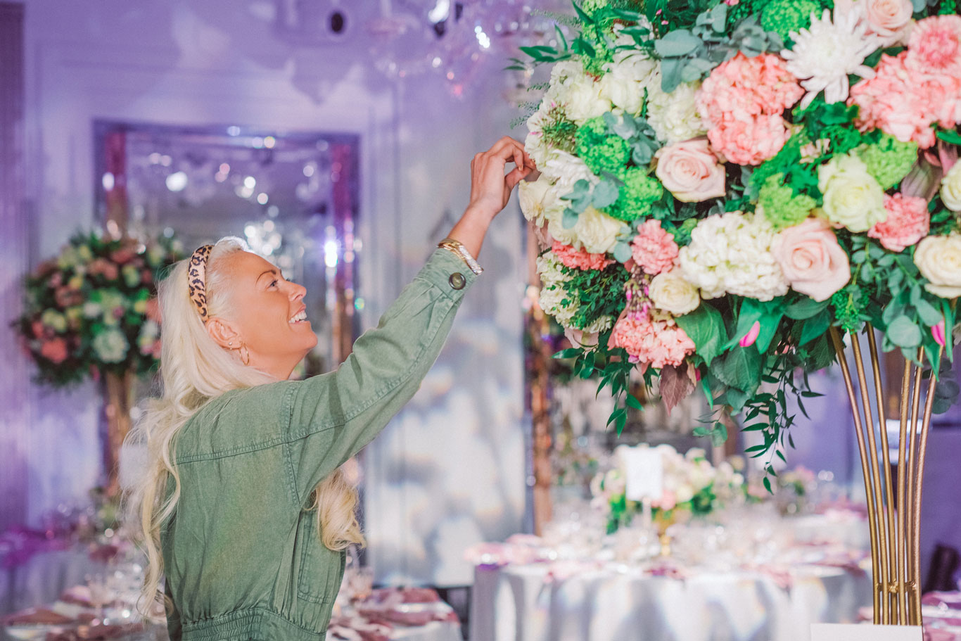 Florist Amie Bone arranges a flower bouquet for a wedding in Claridges Hotel