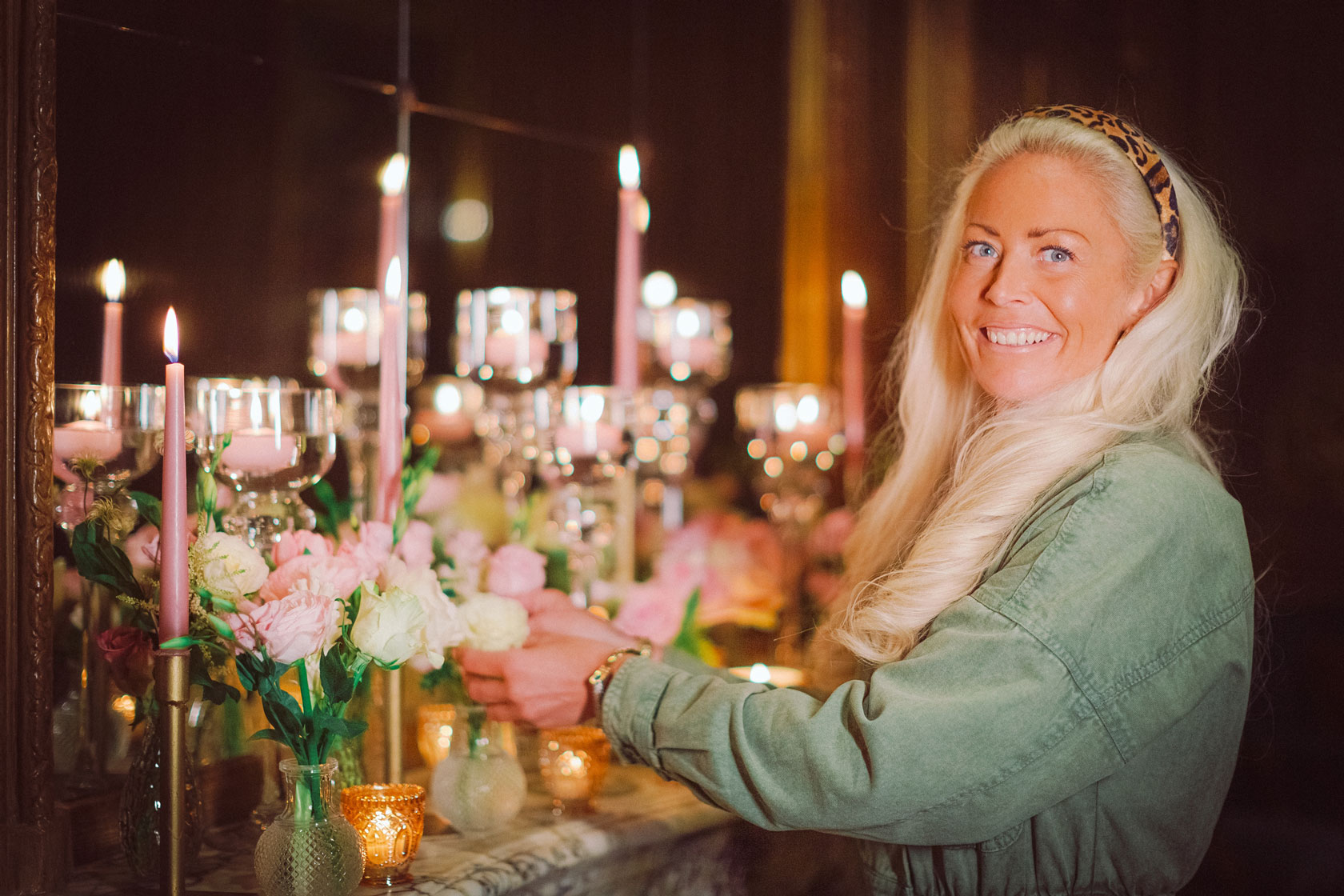 experienced florist Amie Bone arranging flowers on a mantelpiece wedding feature