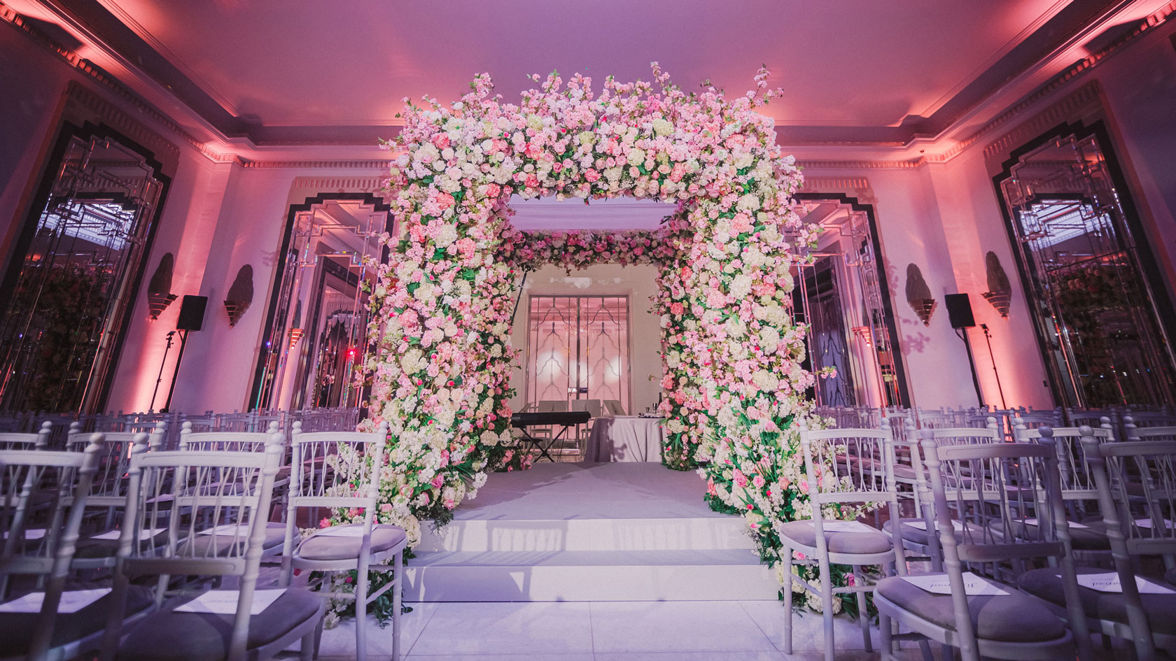 floral chuppah ceremony in grand ballroom for a wedding setting