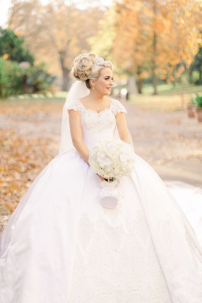 Amie Bone bride in her Eleni Bridal wedding dress with her bridal bouquet